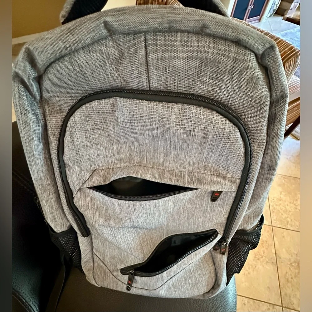 Backpack Excellent condition! Lots of zip compartments. Grey black. Clean!